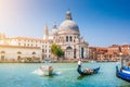 Gondola and boat on Canal Grande with Basilica di Santa Maria della Salute, Venice, Italy Royalty Free Stock Photo