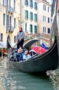 Gondola boat with passengers in Venice, Italy Royalty Free Stock Photo