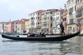 Gondola boat with passengers in Venice, Italy