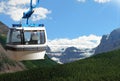 Gondola cable car with snow peaked mountains background
