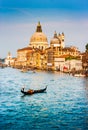 Gondola on Canal Grande with Basilica di Santa Maria della Salute at sunset, Venice, Italy Royalty Free Stock Photo