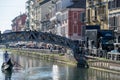 Gondola and gondolier in the Darsena del Naviglio in Milan, Italy.