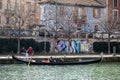 Gondola and gondolier in the Darsena del Naviglio in Milan, Italy.
