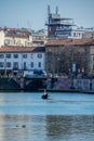 Gondola and gondolier in the Darsena del Naviglio in Milan, Italy.