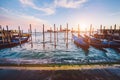 Gondola jetty in Venice, Italy at sunset.