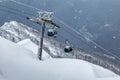 Gondola lifts on ski resort in the winter mountain