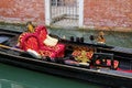 Gondola moored in narrow canal in Venice, Italy