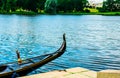 Gondola moored near the shore. Tourism in Venice. Calm rest on the water