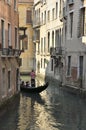 Gondola by a narrow canal