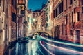 Gondola night ride in Venice, Italy. Royalty Free Stock Photo