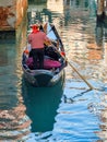 Gondola with passengers on the canal in Venice, Italy Royalty Free Stock Photo