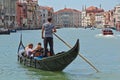 Gondola with passengers in Grand Canal. Venice, Italy Royalty Free Stock Photo