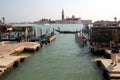 Gondola passing by the Riva degli Schiavoni embankment, Venice, Italy