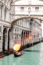 gondola passing under Bridge of Sighs in venice, monument and historical architecture to see