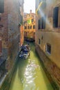 Gondola on a picturesque canal in venice, italy