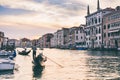 Gondola ride on Grand Canal in Venice, Italy at sunset. Royalty Free Stock Photo