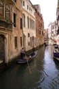 Gondola ride in small canal, Venice Italy