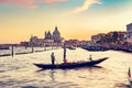 Gondola ride in Venice, Italy at sunset. Royalty Free Stock Photo