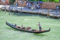 Gondola sails down the channel in Venice