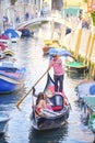 Gondola sails down the channel in Venice