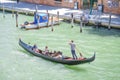 Gondola sails down the channel in Venice