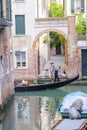 Gondola sails down the channel in Venice