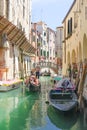 Gondola sails down the channel in Venice