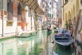 Gondola sails down the channel in Venice