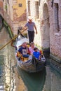 Gondola sails down the channel in Venice