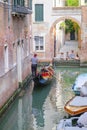 Gondola sails down the channel in Venice