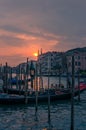Gondola with tourists and gondolier at sunset in Venice. Italian travel landscape Royalty Free Stock Photo