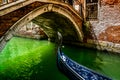 Gondola under the bridges of Venice Royalty Free Stock Photo