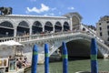 Gondolas and boats moored in front of Rialto Bridge on Grand canal. Venice, Italy Royalty Free Stock Photo