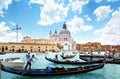 Gondolas on Canal and Basilica Santa Maria della Salute, Venice Royalty Free Stock Photo