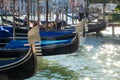 Gondolas and Gondoliers in Venice, sparkling water in summer