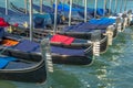 Gondolas in Grand Canal stake pier at golden sunset, Venice, Italy Royalty Free Stock Photo