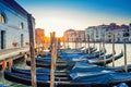 Gondolas moored docked on pier of Grand Canal waterway in Venice Royalty Free Stock Photo