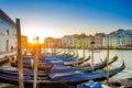 Gondolas moored docked on pier of Grand Canal waterway in Venice Royalty Free Stock Photo