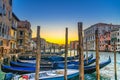 Gondolas moored docked on pier of Grand Canal waterway Royalty Free Stock Photo