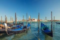 Gondolas Moored Docked On Water In Venice. Gondoliers Sailing San Marco Basin
