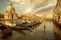 Gondolas moored in Grand Canal and church of Santa Maria della Salute, Venice, Italy Royalty Free Stock Photo