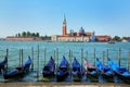 Gondolas moored near San Marco square across from San Giorgio Maggiore island in Venice, Italy Royalty Free Stock Photo