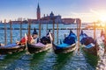 Gondolas moored near San Marco square across from San Giorgio Maggiore island in Venice, Italy. Gondolas were once the main form Royalty Free Stock Photo