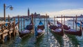 Gondolas moored near San Marco square across from San Giorgio Maggiore island in Venice, Italy. Gondolas were once the main form Royalty Free Stock Photo