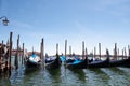 Gondolas moored for the night at dawn in venice Royalty Free Stock Photo