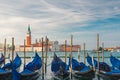 Gondolas moored by Saint Mark square with San Giorgio di Maggiore church on background in Venice, Italy Royalty Free Stock Photo