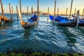 Gondolas moored by Saint Mark square with San Giorgio di Maggiore church in the background - Venice, Venezia, Italy, Europe. Royalty Free Stock Photo