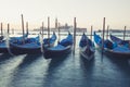 Gondolas moored by Saint Mark square with San Giorgio di Maggiore church in Venice, Royalty Free Stock Photo