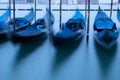 Gondolas moored by Saint Mark square with San Giorgio di Maggiore church in Venice Royalty Free Stock Photo