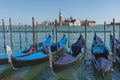 Gondolas near Saint Mark square San Marco and San Giorgio di Maggiore church in the background, in Venice, Italy Royalty Free Stock Photo